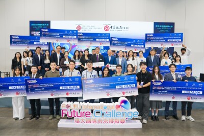 VIP guests, members of the judging panel, and winning teams pose for a group photo on stage.