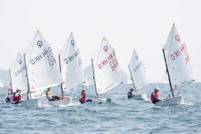 Young sailors competing in the Optimist Class.